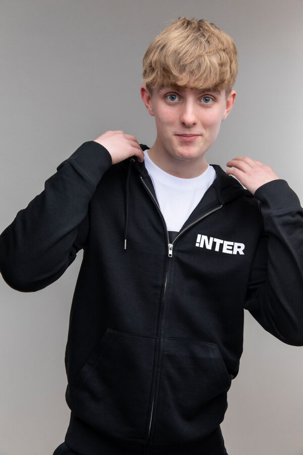 Picture of boy wearing a black iNTER hoodie