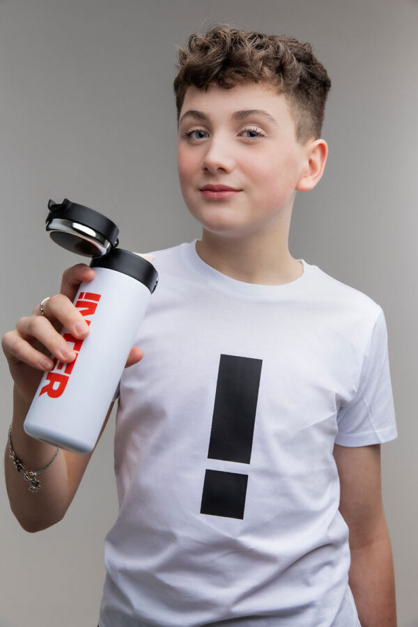 Boy holding an iNTER water bottle